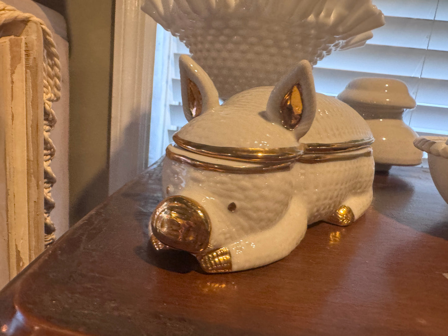 Milk glass and gold trim pig dish