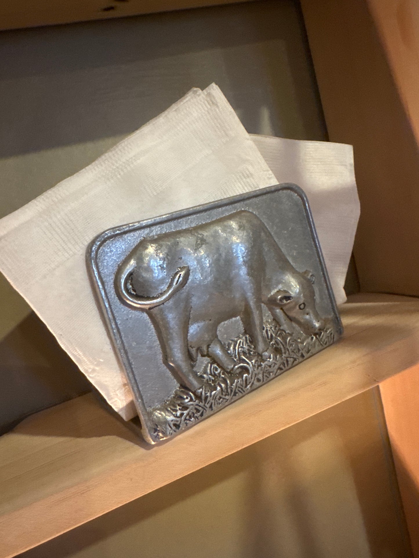 Silver napkin holder with cow