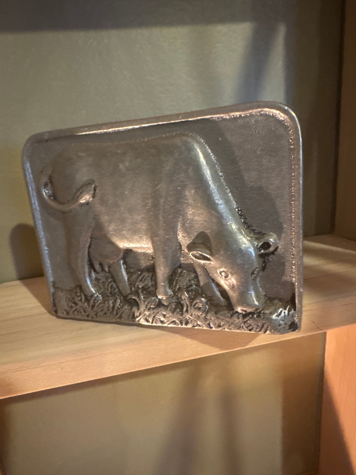 Silver napkin holder with cow